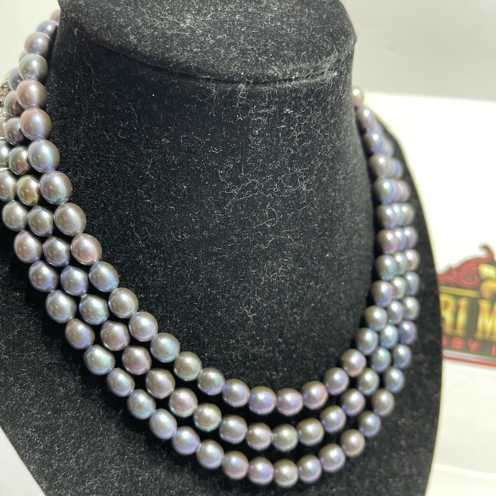 Freshwater Pearl in Blackish purplish long strand in silver lock length 49 in.